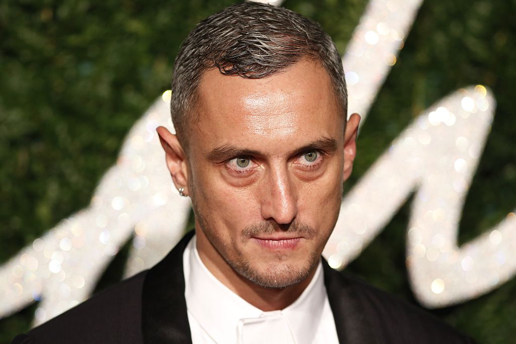 British fashion designer Richard Nicoll poses for pictures on the red carpet upon arrival to attend the British Fashion Awards 2014 in London on December 1, 2014. AFP PHOTO/JUSTIN TALLIS (Photo credit should read JUSTIN TALLIS/AFP/Getty Images)